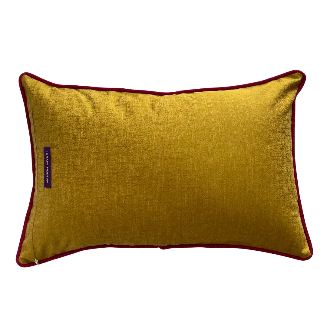 Rectangular mustard yellow vintage cushion with red piping on white background