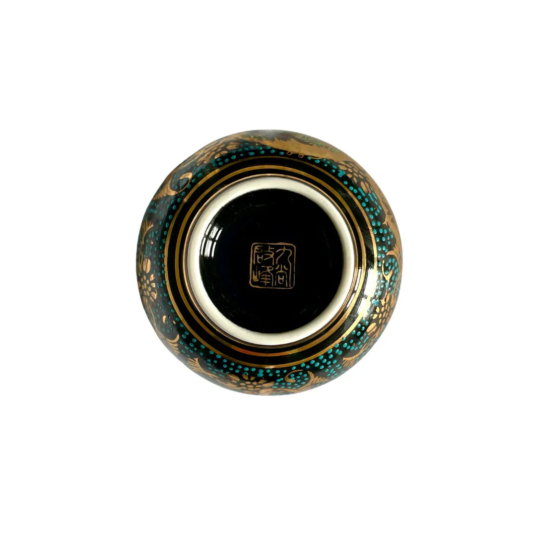 Bottom view of a Japanese Kutani porcelain bowl with gold and turquoise decorative patterns