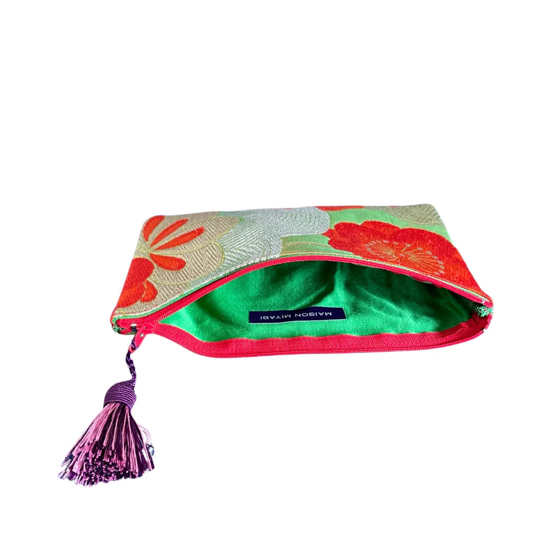 Vintage kimono fabric pouch with floral pattern, green lining, and tassel zipper pull