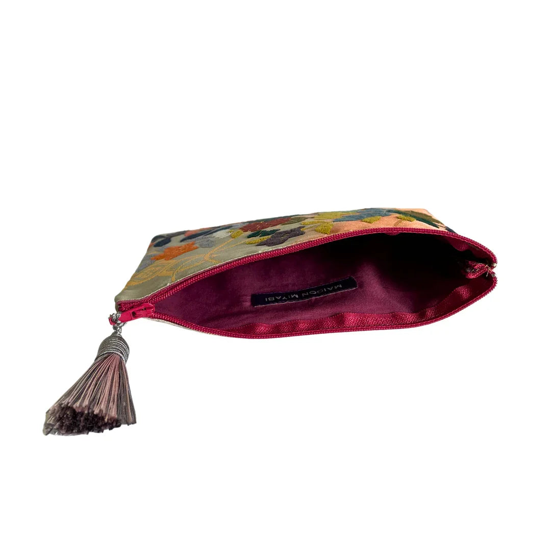 Floral embroidered kimono fabric pouch with pink tassel zipper, open view
