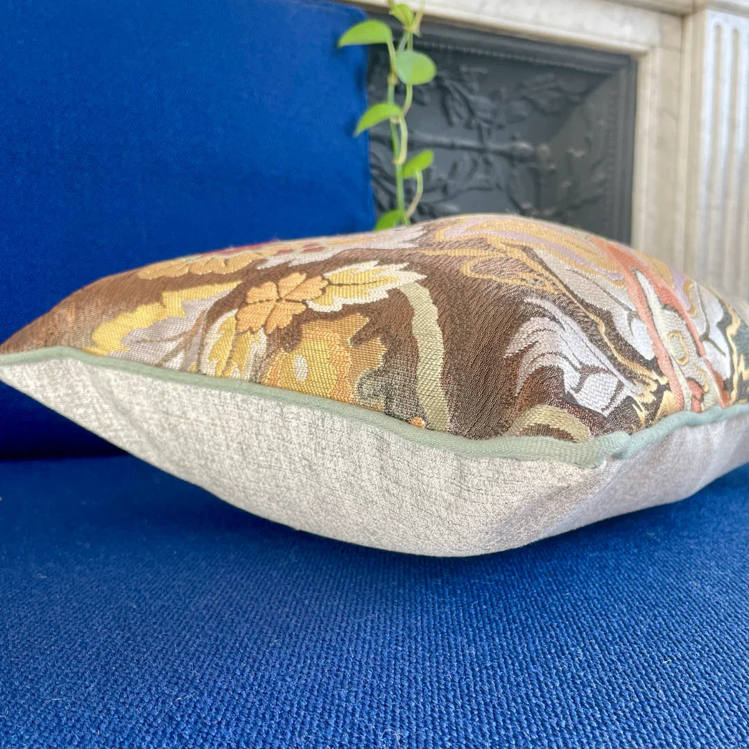 Vintage Obi-Kimono cushion with floral embroidery on blue sofa, elegant and artisanal decor