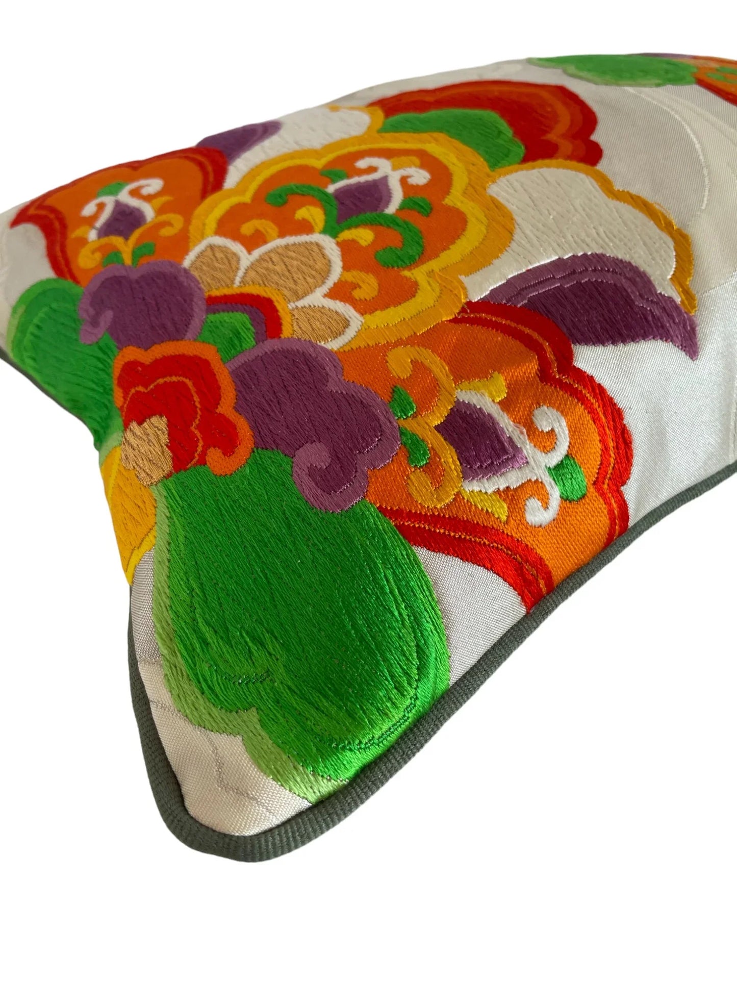 Colorful Japanese obi kimono cushion with floral embroidery in green, orange, and purple