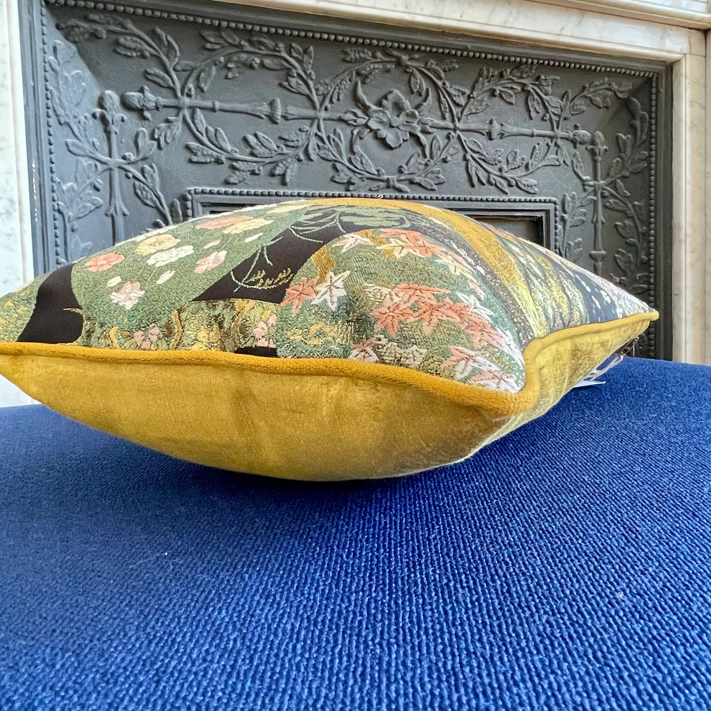 Vintage Japanese Obi-Kimono cushion with floral pattern and yellow velvet base on blue fabric