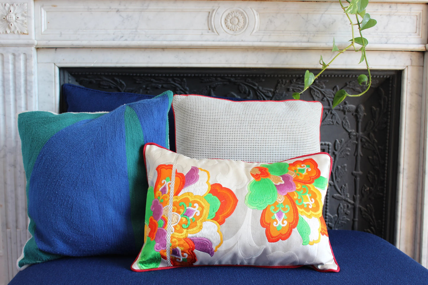 Vintage Obi-Kimono cushion with colorful floral embroidery in a Parisian interior setting