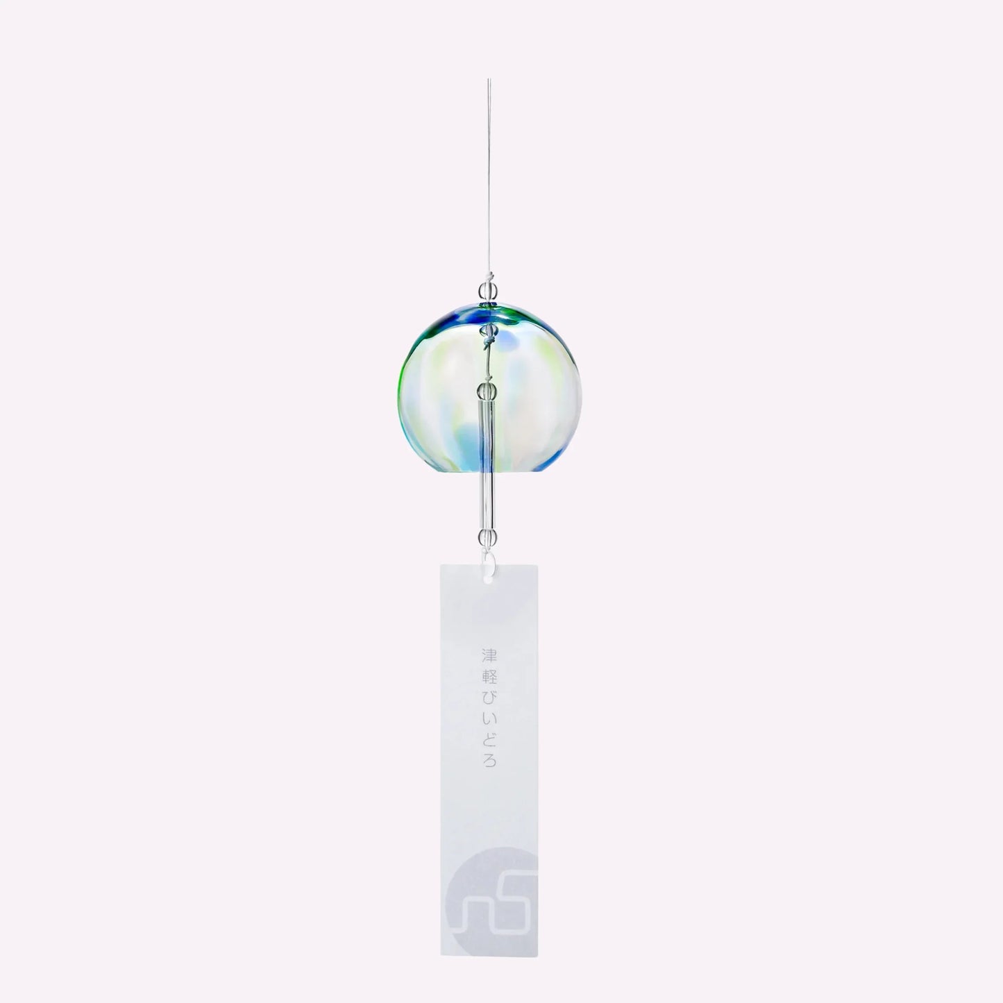 Japanese glass wind chime with blue and green accents and vertical paper tag on white background