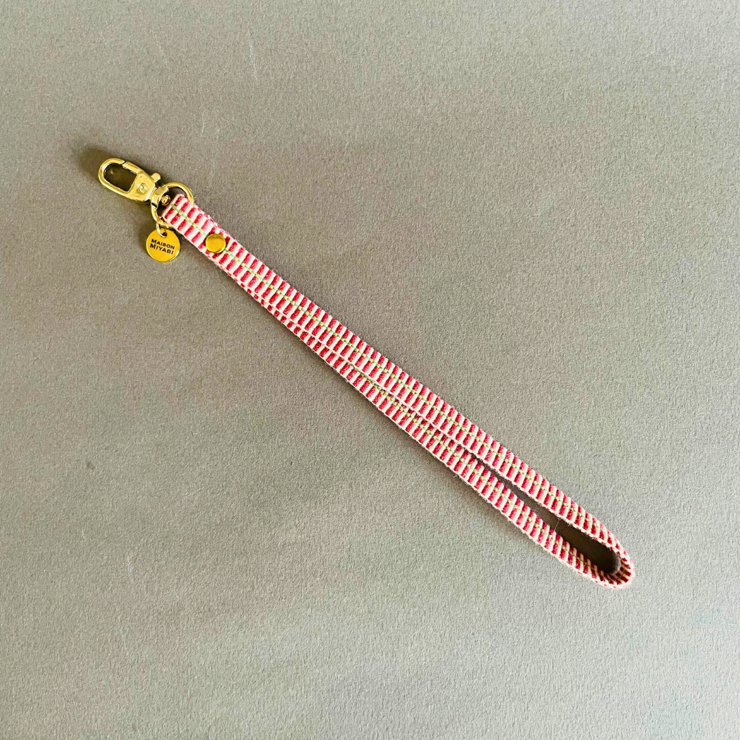 Red and white striped strap with gold hardware by MAISON MIYABI Paris